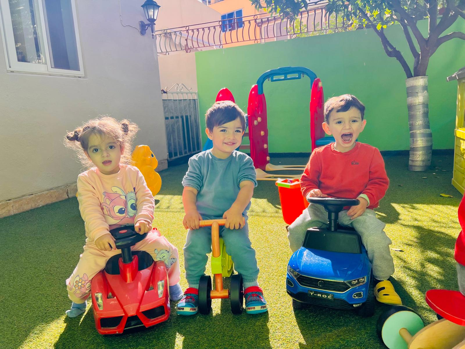 Children riding cars