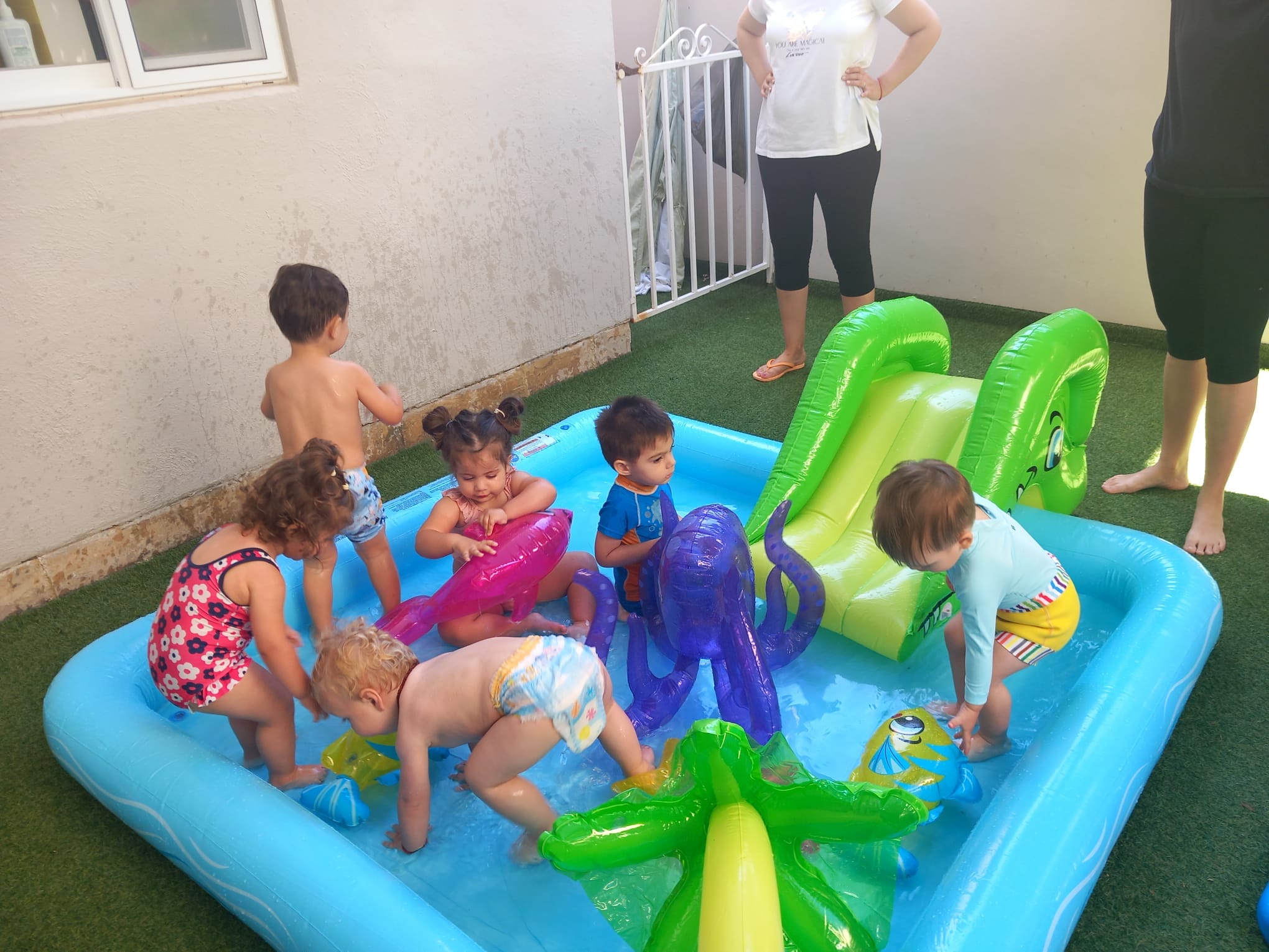 Water play in a small inflatable pool